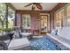 Charming screened porch featuring wicker furniture, brick accents, and a cozy atmosphere at 2043 Shadwell Ct, Gastonia, NC 28056