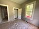 View of a bedroom with a window, door to closet and showing unfinished flooring and walls at 235 Jefferson E St, York, SC 29745