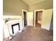A bedroom shows an original fireplace, and awaits personalization to make it a cozy retreat at 235 Jefferson E St, York, SC 29745