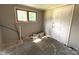 Bright room with a window and a door, showing unfinished flooring and walls at 235 Jefferson E St, York, SC 29745