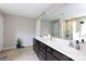 Bright bathroom featuring double vanity with granite countertop, and large mirror, with a view of a glass enclosed shower at 2405 Emma Grace Ln, Rock Hill, SC 29732