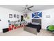 Bedroom featuring a ceiling fan, window, and gray furniture and colorful decor at 2405 Emma Grace Ln, Rock Hill, SC 29732