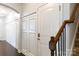 Bright entryway featuring detailed trim work, wood floors, and staircase at 2405 Emma Grace Ln, Rock Hill, SC 29732