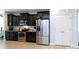 Spacious kitchen featuring dark cabinets, stainless steel appliances, and a walk-in pantry at 2405 Emma Grace Ln, Rock Hill, SC 29732