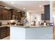 Well-equipped kitchen featuring granite countertops, stainless steel appliances, and dark wood cabinets at 2405 Emma Grace Ln, Rock Hill, SC 29732