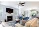 Bright and open living area featuring fireplace, tv, and view into sunroom at 2405 Emma Grace Ln, Rock Hill, SC 29732