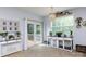 Bright living room with chandelier, dog crate feature, and outdoor access at 2405 Emma Grace Ln, Rock Hill, SC 29732