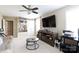 Living room with a mounted TV, shelving for memorabilia, and a comfortable white sofa at 2405 Emma Grace Ln, Rock Hill, SC 29732