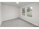 Bright bedroom featuring neutral walls, carpet, and double hung windows with views at 2583 Watson Dr, Lancaster, SC 29720