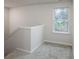 Landing area with a window and carpeted floor at 2583 Watson Dr, Lancaster, SC 29720