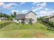 This home features a spacious, fenced-in backyard with a pergola-covered patio, ideal for entertaining at 2606 Cheverny Pl, Concord, NC 28027