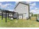 The backyard features a pergola-covered deck and a well-maintained lawn, perfect for outdoor enjoyment at 2606 Cheverny Pl, Concord, NC 28027
