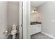 Bathroom featuring a toilet, vanity, and tile floor at 2606 Cheverny Pl, Concord, NC 28027