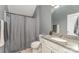 Gray bathroom featuring a shower with curtain and vanity with granite countertop at 2606 Cheverny Pl, Concord, NC 28027