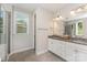 Bathroom showcasing a double vanity, tile floor and separated glass enclosed shower at 2606 Cheverny Pl, Concord, NC 28027
