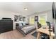 Bedroom with three windows, comfortable bedding, a dark dresser, and an office desk at 2606 Cheverny Pl, Concord, NC 28027