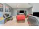 Large bonus room features arcade games, media center, and comfortable seating for entertaining guests at 2606 Cheverny Pl, Concord, NC 28027