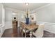 Elegant dining room showcases a rustic wood table, stylish seating, and sophisticated decorative accents at 2606 Cheverny Pl, Concord, NC 28027
