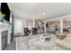 Open-concept living area showcasing hardwood floors, a fireplace, and staircase at 2606 Cheverny Pl, Concord, NC 28027