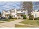 Attractive two-story home featuring a welcoming front porch, well-kept lawn, and appealing curb appeal at 2614 Ocracoke St, Charlotte, NC 28208