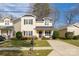 Charming two-story home with a well-manicured lawn, inviting front porch, and a tidy appearance at 2614 Ocracoke St, Charlotte, NC 28208