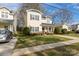 Well-maintained two-story home with inviting curb appeal, a cozy front porch, and mature landscaping at 2614 Ocracoke St, Charlotte, NC 28208