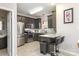 Modern kitchen features stainless steel appliances, dark wood cabinets and granite countertops at 2614 Ocracoke St, Charlotte, NC 28208