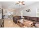 Spacious living room with ample seating, wood floors, natural light, and an adjacent dining area at 2614 Ocracoke St, Charlotte, NC 28208