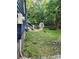 Backyard view showing electrical service, shed, and firepit at 27092 Village Dr, Fort Mill, SC 29708