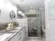 Contemporary bathroom with double sinks and large glass enclosed shower with bench at 27092 Village Dr, Fort Mill, SC 29708