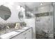 Modern bathroom showcasing double sinks and a frameless glass shower at 27092 Village Dr, Fort Mill, SC 29708
