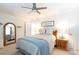 Comfortable bedroom with natural light, ceiling fan and a wooden bed frame at 27092 Village Dr, Fort Mill, SC 29708