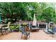 Spacious back deck featuring multiple seating areas in a peaceful setting at 27092 Village Dr, Fort Mill, SC 29708