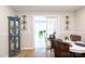 Charming dining area with wood flooring, stylish lighting, and an adjacent sunroom at 27092 Village Dr, Fort Mill, SC 29708
