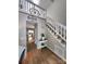 Inviting foyer with hardwood floors, high ceilings, and staircase leading to a loft area at 27092 Village Dr, Fort Mill, SC 29708