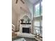 Bright living room featuring a stone fireplace and large windows at 27092 Village Dr, Fort Mill, SC 29708