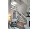 Open living room with hardwood floors, fireplace, and staircase leading to a loft area at 27092 Village Dr, Fort Mill, SC 29708
