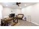 Comfortable home office space with wood desk, ceiling fan, and natural light at 27092 Village Dr, Fort Mill, SC 29708