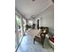 Inviting sunroom with comfortable wicker furniture, ceiling fan, and access to the deck for seamless indoor-outdoor living at 27092 Village Dr, Fort Mill, SC 29708
