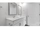 A bright bathroom featuring double sinks with modern fixtures at 3136 Ora Smith Rd, Lincolnton, NC 28092