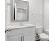 Bathroom features a white vanity, framed mirror, toilet, and bathtub with white tile at 3136 Ora Smith Rd, Lincolnton, NC 28092