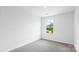 Bright bedroom with neutral carpet, white walls, and a window providing natural light at 3136 Ora Smith Rd, Lincolnton, NC 28092