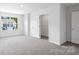 Carpeted bedroom featuring an open closet and natural light at 3136 Ora Smith Rd, Lincolnton, NC 28092