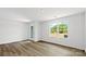 Bright bedroom with wood-look floors and a large window offering plenty of natural light at 3136 Ora Smith Rd, Lincolnton, NC 28092