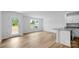 Open-concept living room with wood-look floors and a kitchen island at 3136 Ora Smith Rd, Lincolnton, NC 28092