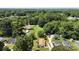 Aerial view capturing the home's setting amidst a lush, tree-filled landscape, creating a private oasis at 321 E Taylor St, Landis, NC 28088