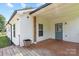 Covered back porch area with wooden deck and access to the home at 321 E Taylor St, Landis, NC 28088