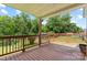 Large backyard deck offering outdoor living space and views of the tree-lined yard at 321 E Taylor St, Landis, NC 28088