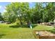 Expansive backyard offers a playground and sandbox, perfect for outdoor enjoyment at 321 E Taylor St, Landis, NC 28088