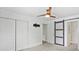 Bedroom with fan, closet, and access to the ensuite bathroom through modern sliding barn door at 321 E Taylor St, Landis, NC 28088